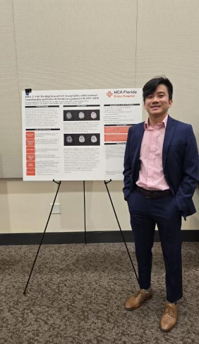One of our residents during their poster presentation at the American Academy of Neurology conference on July 2024.