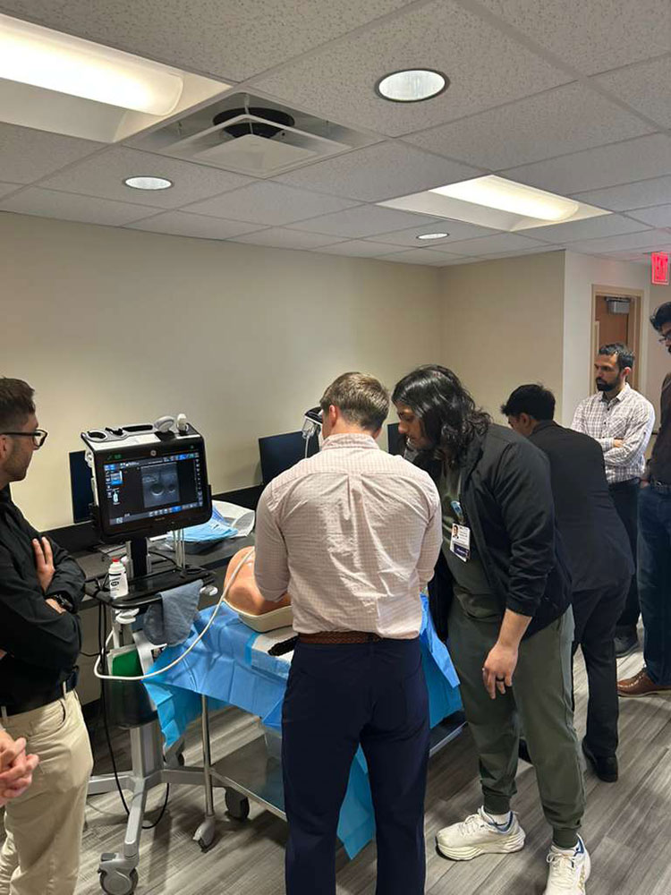 More residents working on a central line simulation